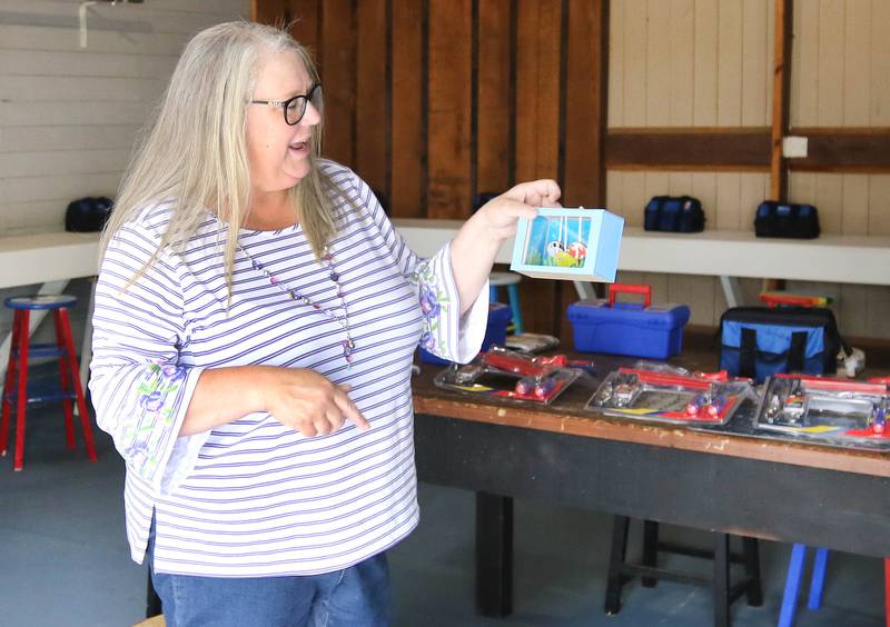 Tammy McMahan, founder and executive director of the Ruth Project, talks Thursday, July 13, 2023, about some of the projects the kids can do in one of the barns on the organization’s 33-acre farm in Sycamore. The Ruth Project is a group based in Elgin that provides support for foster parents and children.