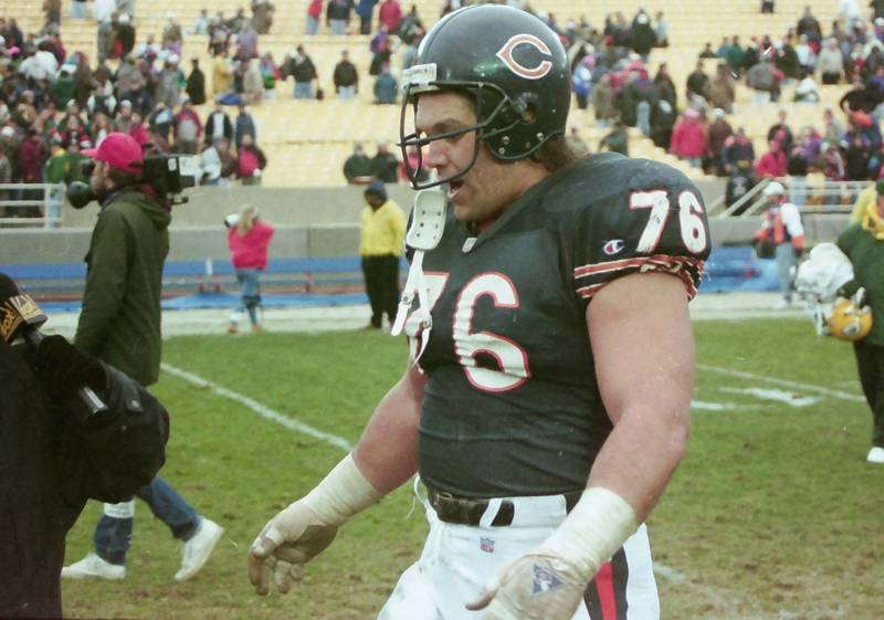 Chicago Bears defensive lineman Steve McMichael walks off of the field during a game in 1990.