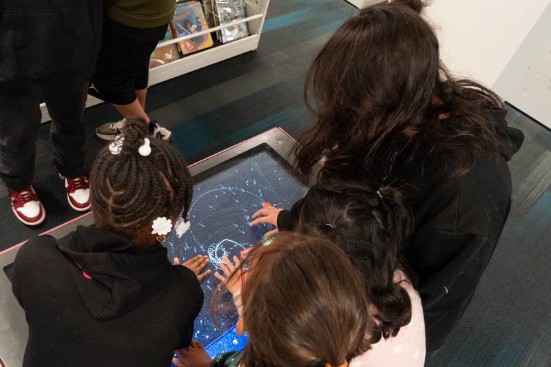 The Joliet Public Library at 150 N. Ottawa St. in Joliet is hosting an all-ages, interactive Exoplanet exhibit from NASA through Feb. 28. Pictured are Rheah Needon, Bella Ramirez, Merda Ramirez and Miranda Espina.
