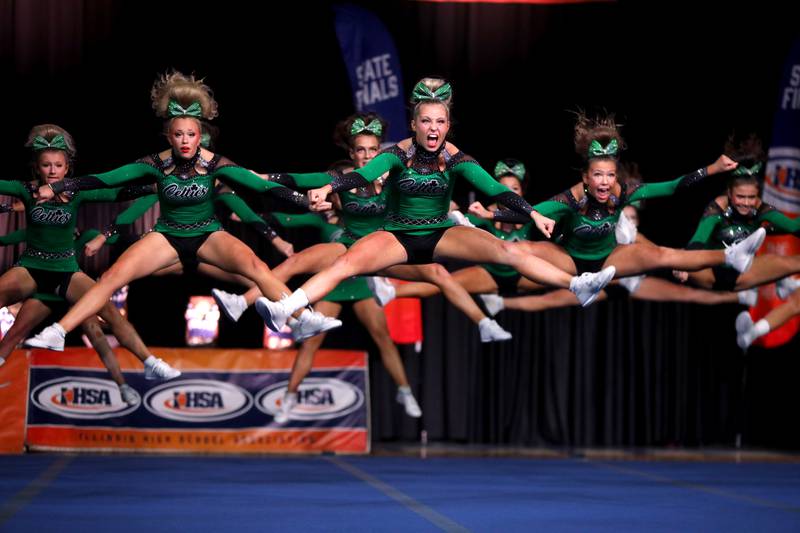 Members of the Providence Catholic cheerleading team compete in the medium team division of the IHSA State Finals on Saturday, Feb. 8, 2025 at Grossinger Motors Arena in Bloomington.