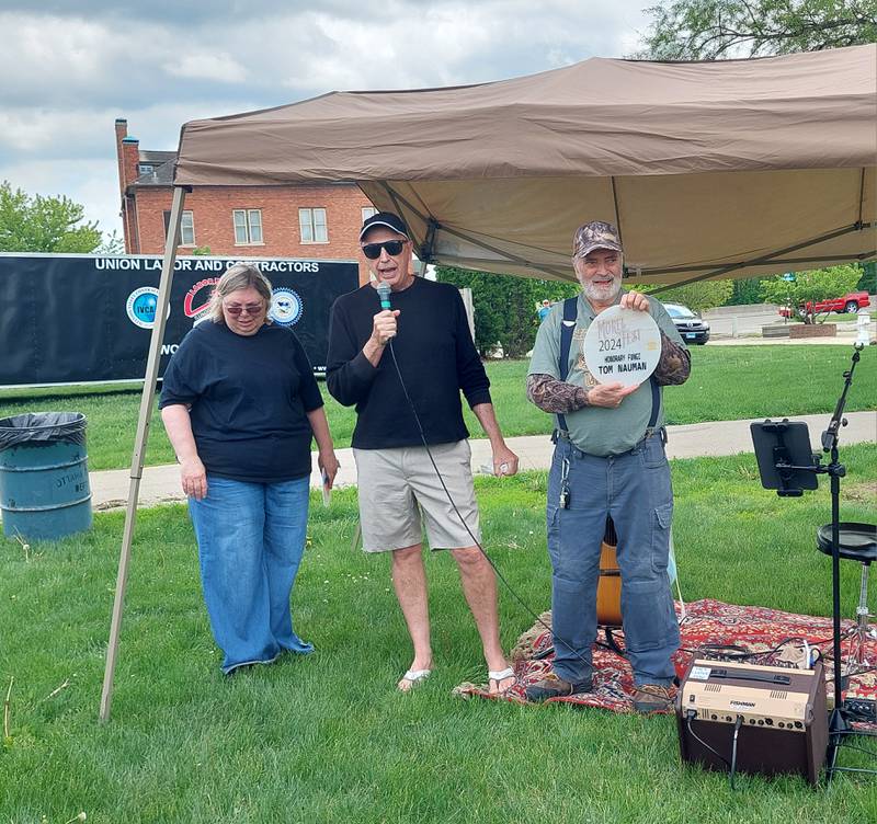 Tom Nauman was given the honorary fungi award Saturday, May 4, 2024, from Ottawa Area Chamber of Commerce Executive Director Jay McCracken (middle) and Donna Reynolds at the Ottawa Visitors Center for his efforts that are instrumental to bringing the Midwest Morel Fest to Ottawa.