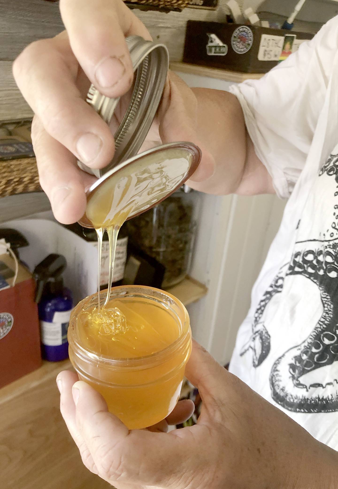 A jar of pure crude CBD oil, grown on Stacy McCaskill's Hempstock Pharm, is shown here at the McHenry County Fair on Aug. 6, 2022. The oil is added to many CBD-infused products McCaskill sells.
