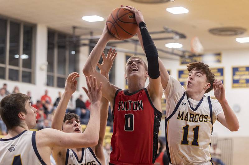 Fulton’s Baylen Damhoff works the basket against Polo players Monday, Feb. 12, 2024 at Polo High School.