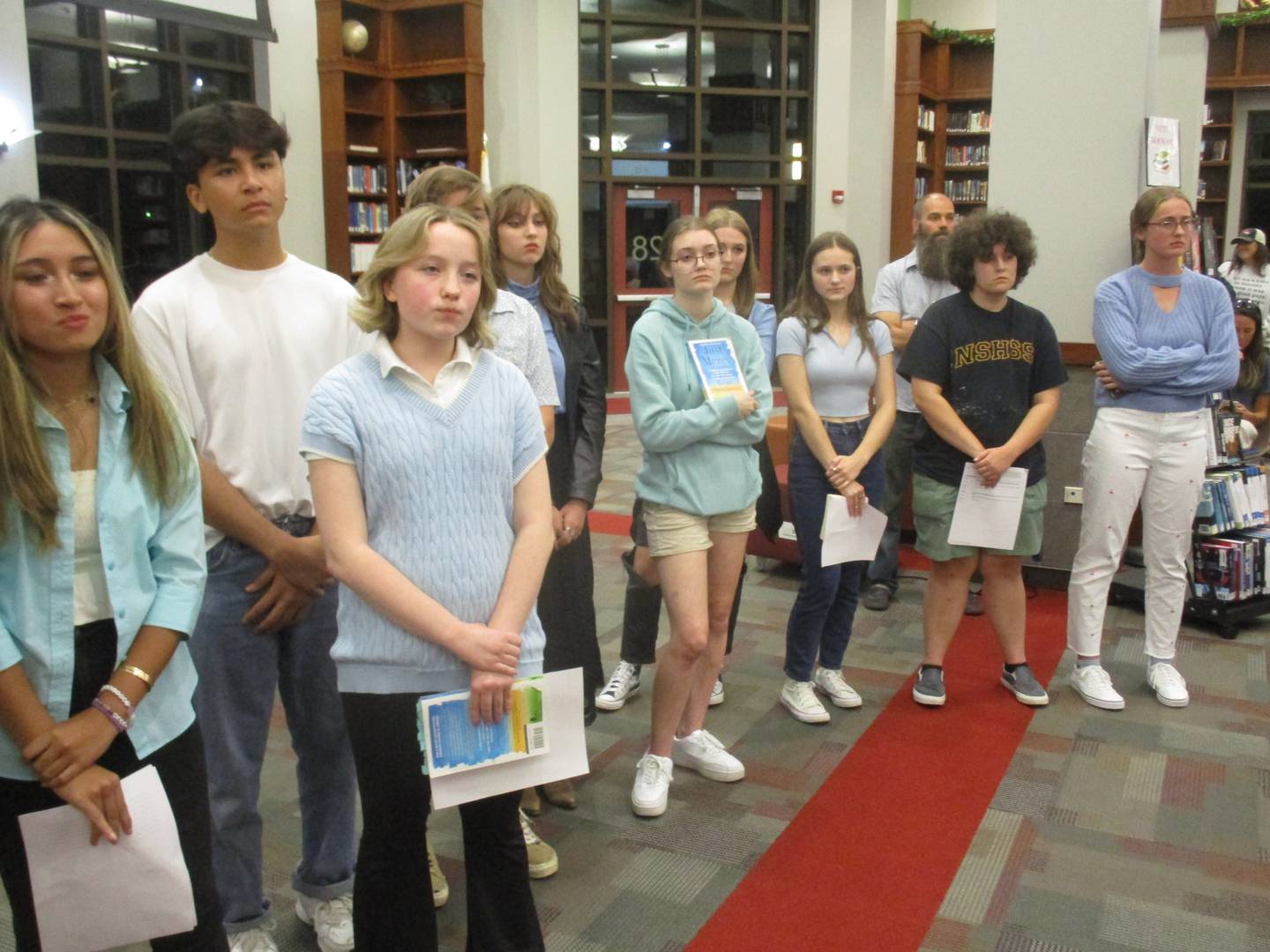 Yorkville High School students who spoke before the Yorkville School Board on Sept. 25, 2023 at the high school library listen to the discussion about the board's decision to prohibit use of the book "Just Mercy" in an English class.