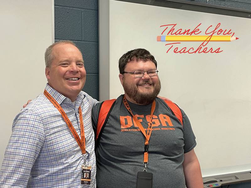 Greg Solomon (left), DeKalb High School humanities teacher pictured with DeKalb High School Instructional Assistant James Zucker (right), who is also a former student of Mr. Solomon's and submitted a nomination for the 2023 Wirtz Award Excellence in Teaching. (Photo provided by DeKalb District 428)