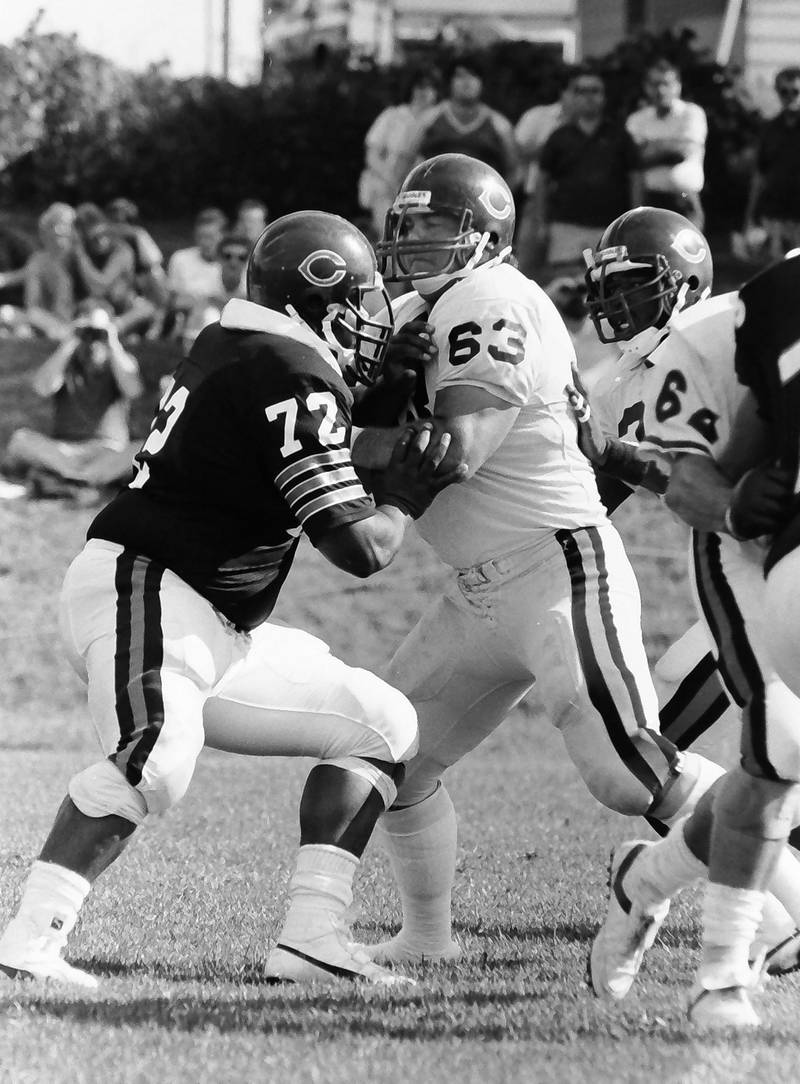 Chicago Bears defensive tackle William Perry "The Refrigerator" and teammate Jay Hilgenberg scrimmage during training camp on Wednesday, June 12, 1985 in Platteville Wis.