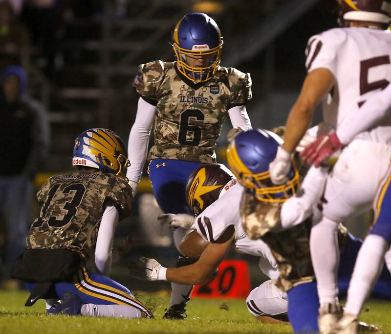 Richmond-Burton's Daniel Kalinowski blocks the field goal attempt of Johnsburg's Conor Benz during a Kishwaukee River Conference football game on Friday, Oct.6, 2023, at Johnsburg High School.