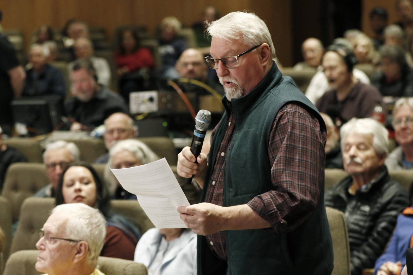Thomas Joerger asks Democratic U.S. Rep. Bill Foster a question during a town hall on Wednesday, April 16, 2025, at McHenry County College's Luecht Auditorium in Crystal Lake.