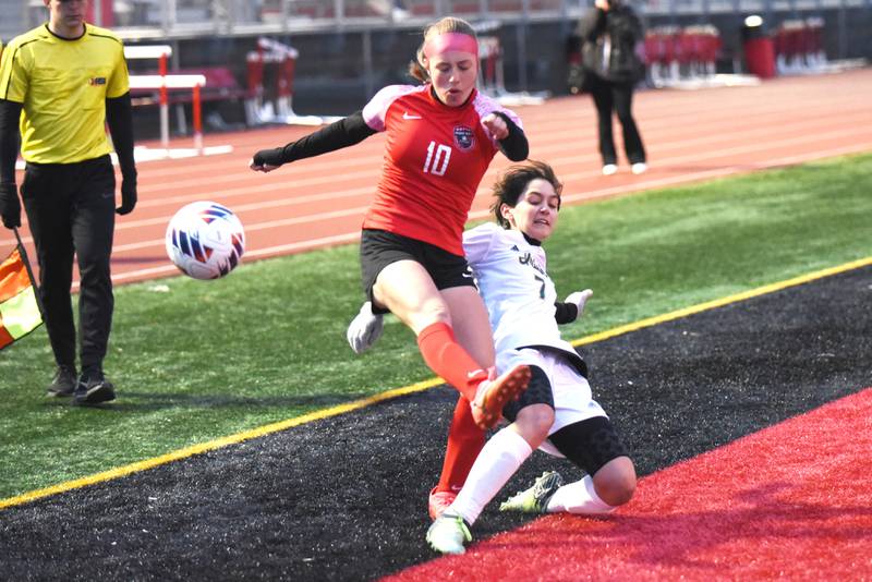 Bradley-Bourbonnais' Harper Tollefson, left, has her crossing pass defended by Bishop McNamara's Lily Walker-Dionne during a game at Bradley-Bourbonnais Tuesday, April 1, 2025.