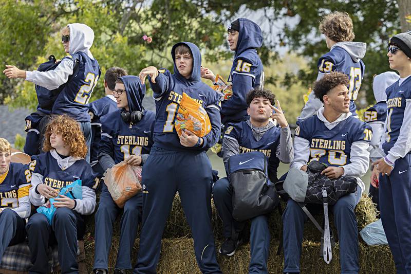 The Sterling High School football team fires candy from their float Friday, Oct.6, 2023 during the homecoming parade. Sterling takes on the Quincy Blue Devils Friday night in football.