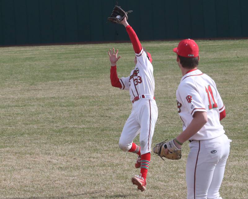 L-P's Jett Hill catches a fly ball as teammate Jackson Piecha looks on on Thursday, April 3, 2025 at Huby Sarver Field inside the L-P Athletic Complex in La Salle.