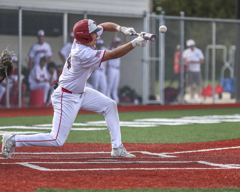 Yorkville's Frank Pavlik (14) bunts during baseball game between Oswego East at Yorkville. Monday, May 12, 2025 in Yorkville.