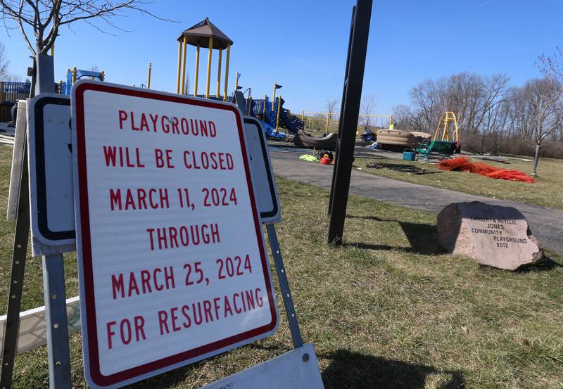 A sign reads "playground will be closed March 11, 2024-March 25, 2024 for resurfacing at Rotary Park on Monday, March 11, 2024 in La Salle. The playground will be re-surfaced and completed on March 25. The playground will be closed until work is finished.