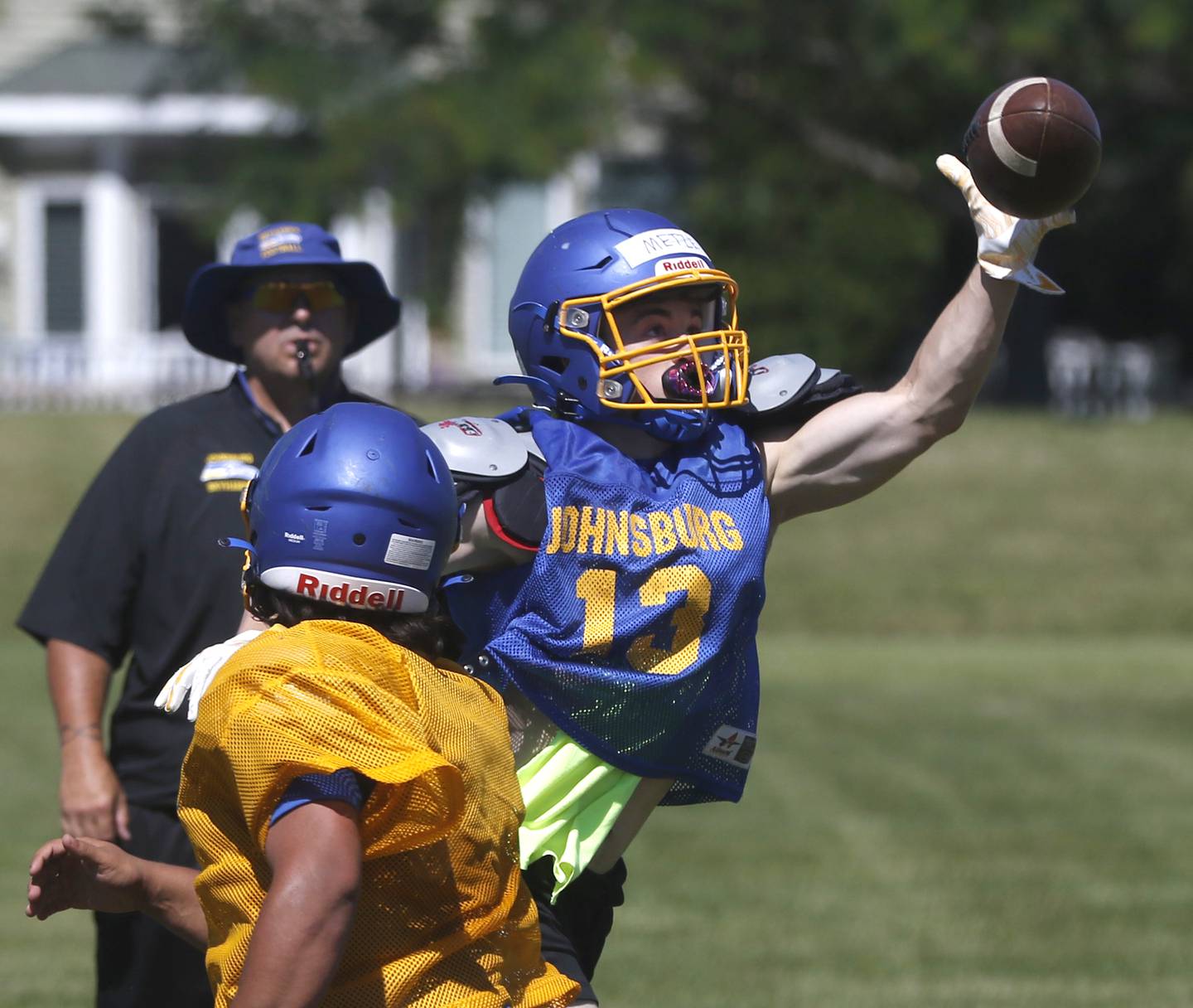 Jake Metze catches the ball during summer football practice Thursday, June 23, 2022, at Johnsburg High School in Johnsburg.