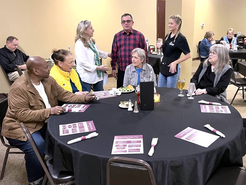 A table of regulars to the fish fry chat before dinner Friday, March 20, 2026, during the annual Lenten season fish fry at Faranda’s Banquets in DeKalb. The fish fries are 4 to 8 p.m. Fridays through April 3 at the banquet center and a portion of the procedes go to support multiple social service agencies in DeKalb County.