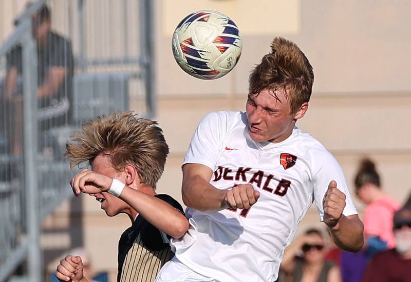 Sycamore's Gavin Crouch (left) and DeKalb’s Sean Kolkebeck go after a header during their game Tuesday, Oct. 3, 2023, at Sycamore High School.