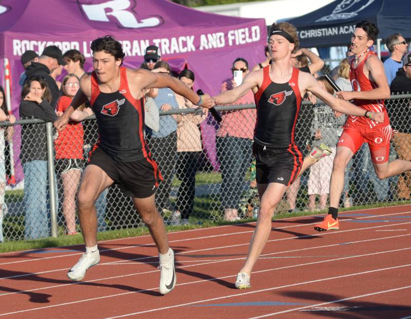 Forreston's Jonathan Milnes takes the baton from Brody Schwartz in the 4x200 relay at the 1A Oregon Sectional at Landers-Loomis Field on Friday, May 23, 2025. Milnes, Schwartz, Eli Ferris, and Noah Dewey won the race and advanced  to the state meet at Eastern Illinois University on Thursday, May 29.