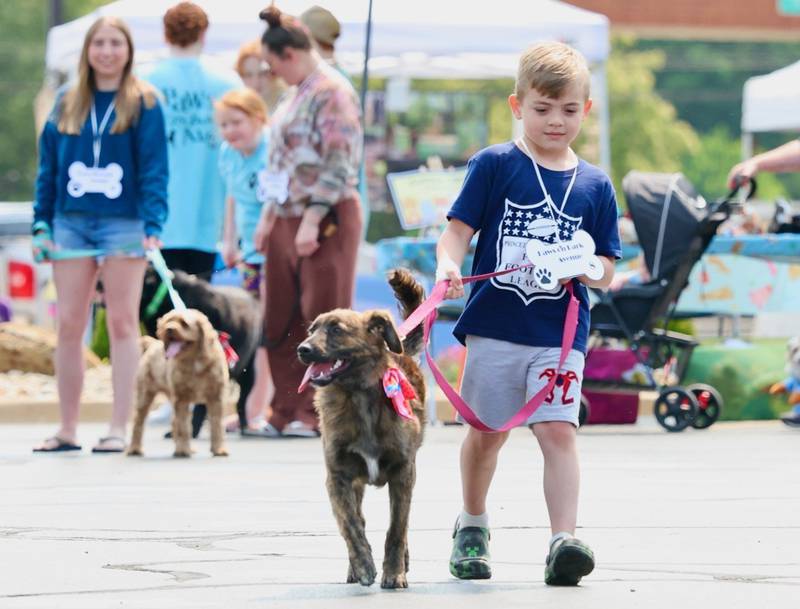 Asher Weston and Sophie entertain the Residents of Greenfield Retirement Home in Princeton during the Paws on Park Avenue parade on Saturday, May 31.