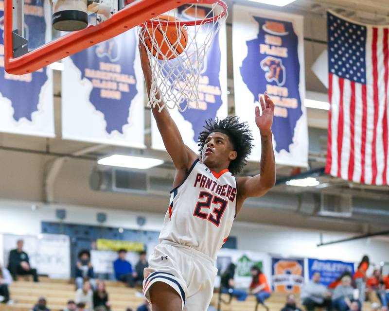 Oswego's Dasean Patton (23) puts in a layup during their basketball game between Yorkville at Oswego, Tuesday Dec 10, 2024 in Oswego.