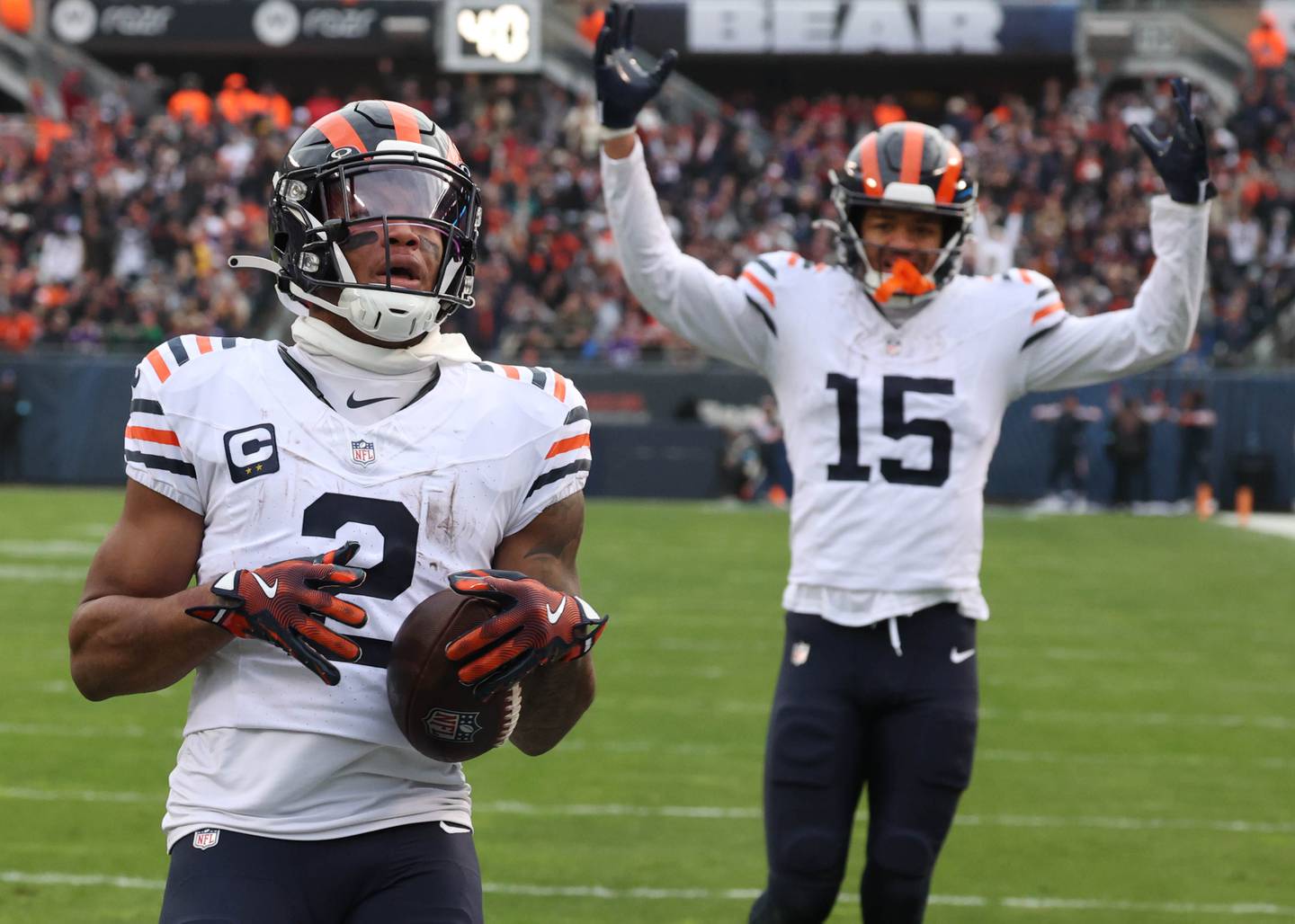 Chicago Bears wide receiver DJ Moore scores a touchdown as teammate Rome Odunze looks on during their game against the Minnesota Vikings Sunday, Nov. 24, 2024, at Soldier Field in Chicago.