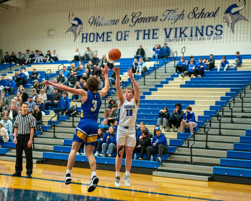 Geneva’s Jimmy Rasmussen (15) shoots a three-pointer against Wheaton North's Jack Speers (3) during a basketball game at Geneva High School on Friday, Jan 6, 2023.