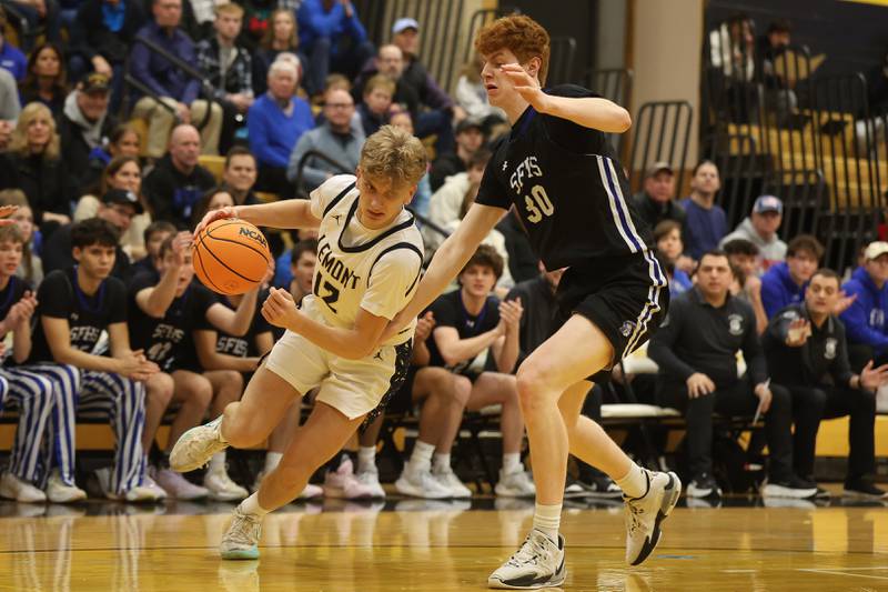 Lemont’s Ryan Crane drives around St. Francis’s Carter Clark in the Class 3A Hinsdale South Regional semifinal game on Tuesday, March 3, 2026 in Darien.