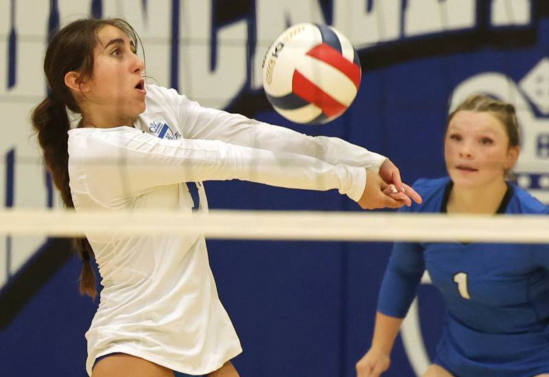 Hinckley-Big Rock’s Hannah Lianas receives a serve in front of teammate Felicity Thorton during their match against Aurora Christian Tuesday night at the school in Hinckley.