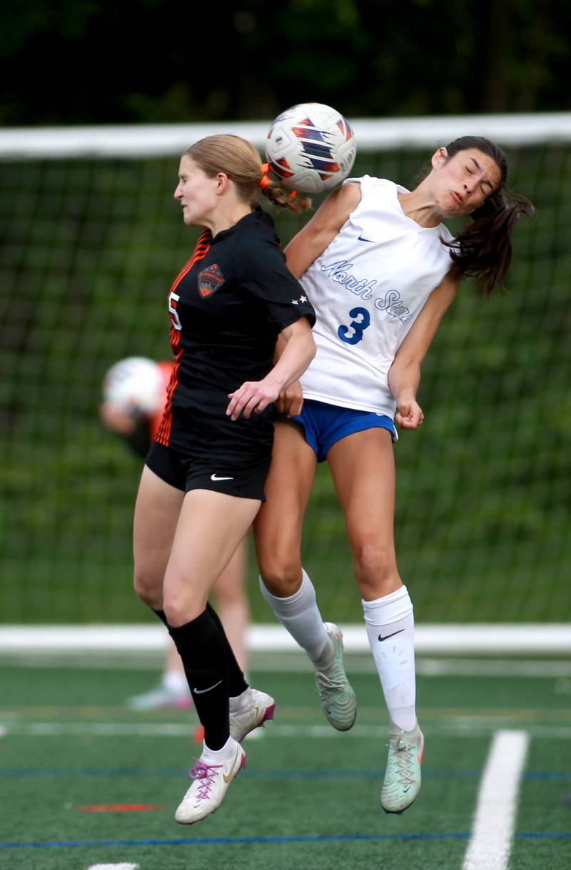 St. Charles East's Anika Dodrill and St. Charles North's Aubri Magana head the ball during a Class 3A Glenbard West Sectional semifinal game on Tuesday, May 27, 2025 in Glen Ellyn.