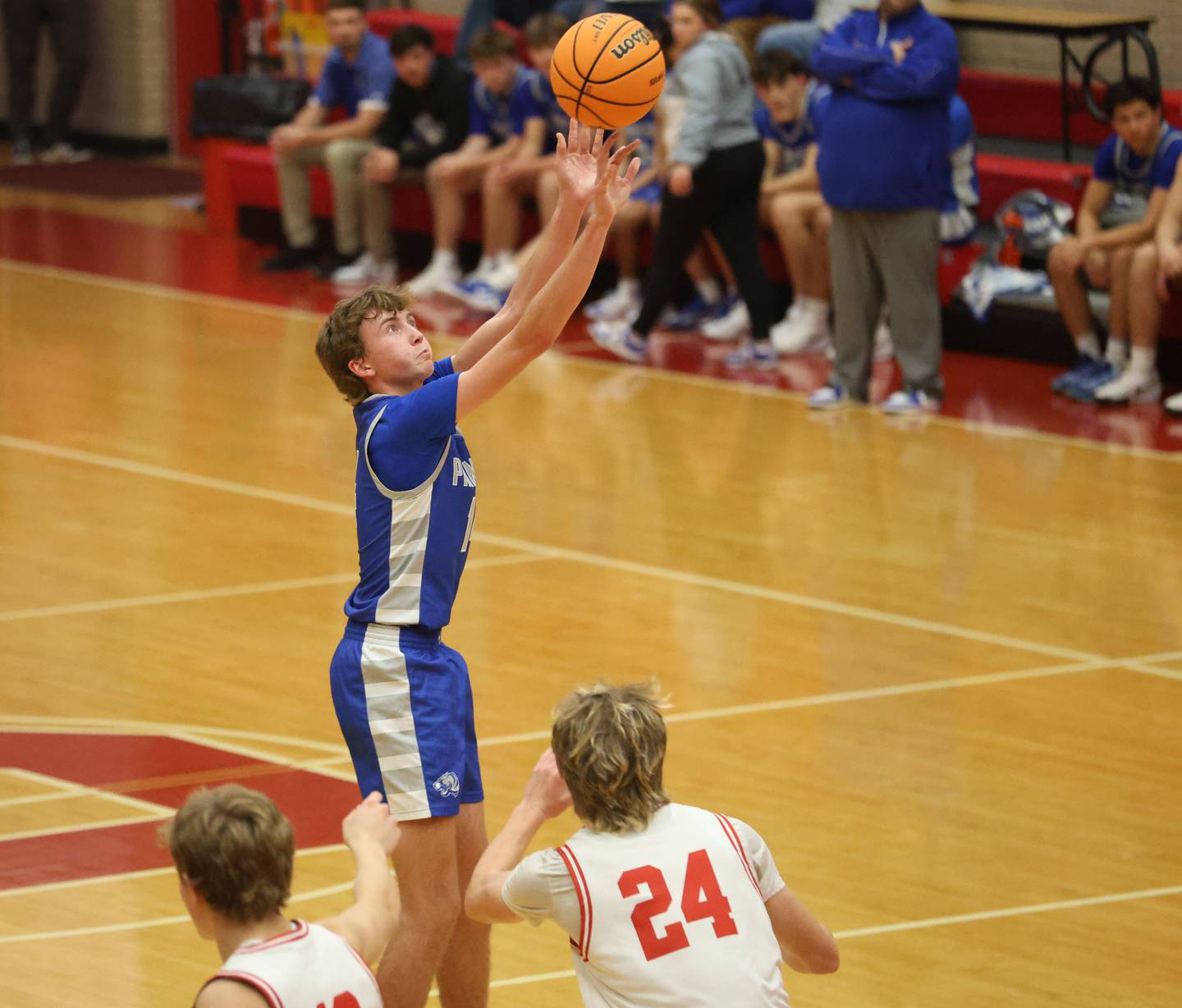 Princeton's Jackson Mason shoots a jump shot over Ottawa's George Shumway during the Dean Riley Shootin' The Rock Thanksgiving Tournament on Monday Nov. 24, 2025 in Kingman Gymnasium at Ottawa High School.