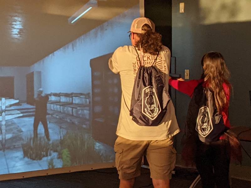 Sandwich native Alex Burnett and his cousin, Tatiana Frausto, enjoyed hunting zombies on the Sandwich Police Department's training simulator during the department's Halloween Bash on Oct. 23.