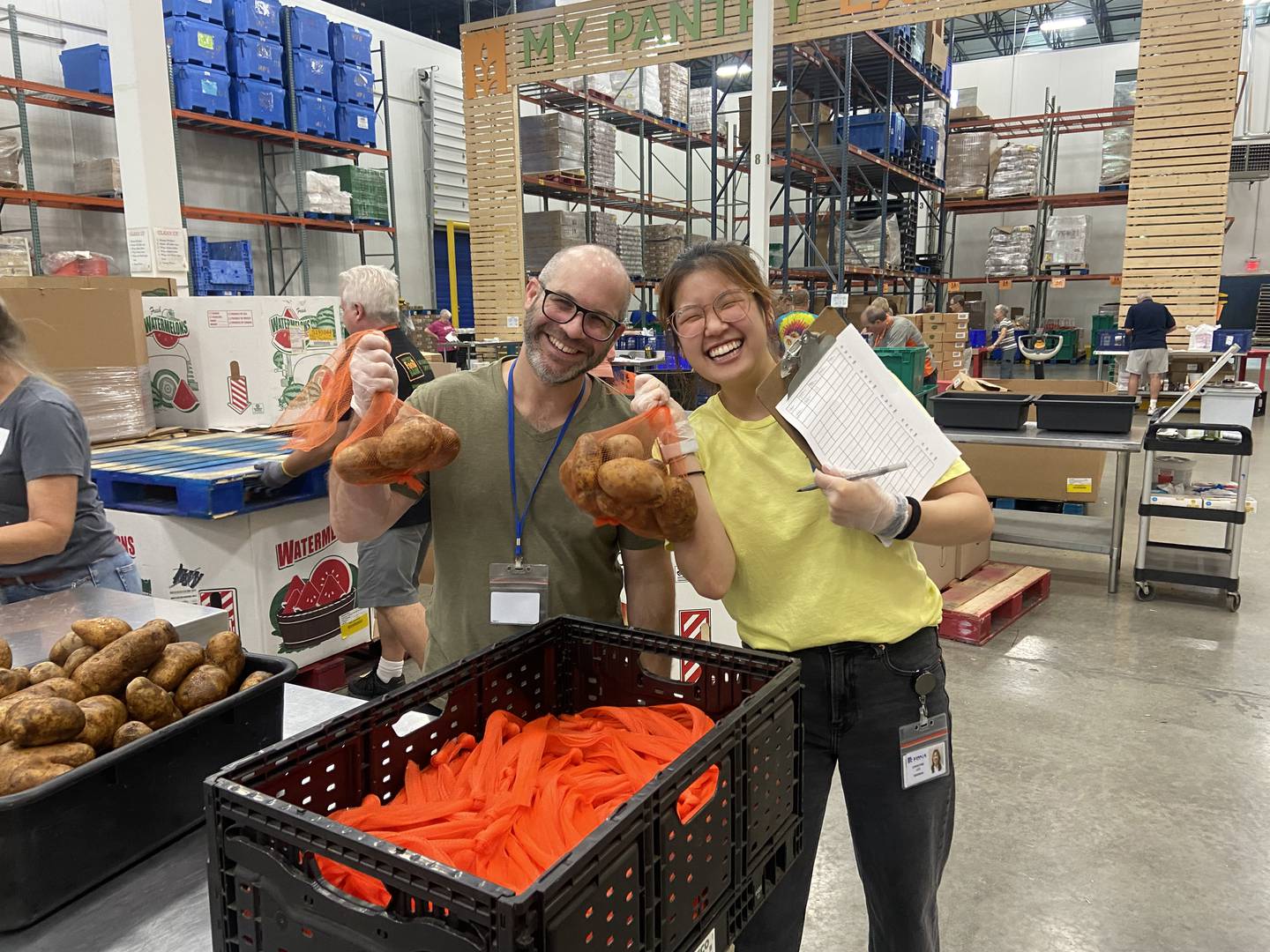 Volunteers with McCormick Health and Beverage package items to be distributed to area food pantries from Northern Illinois Food Bank. The bank expects to service thousands this holiday season, noting the need to address food insecurity is higher than numbers recorded during the COVID-19 pandemic.