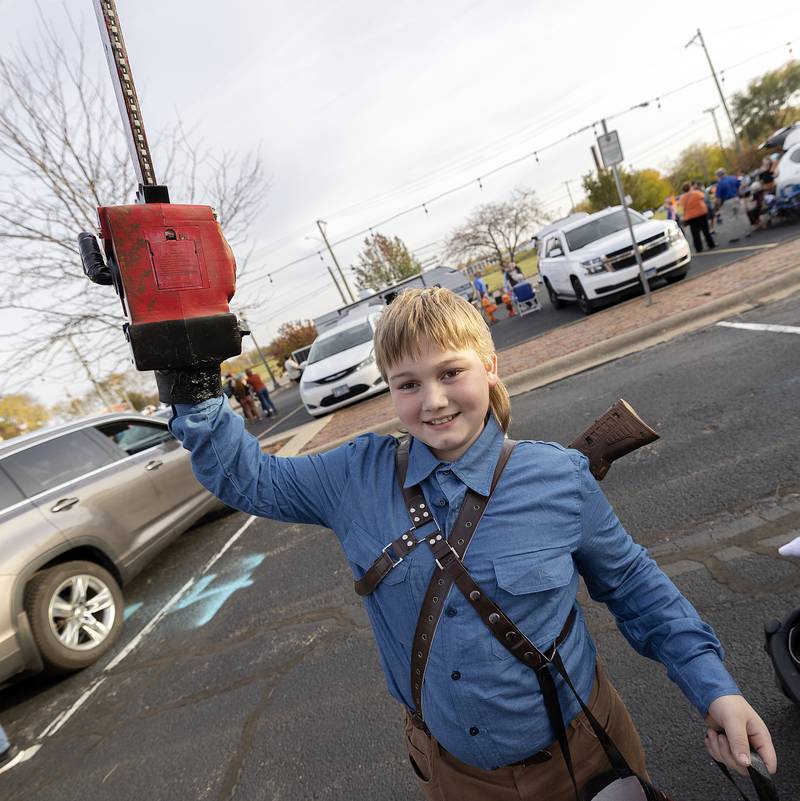 Delsin Mulnix, 10, looks to fight the Evil Dead as Ash from the movie series Tuesday, Oct. 29, 2024, during a trunk-or-treat event at the Sterling Police Department.