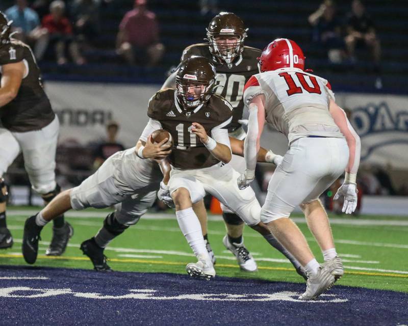Joliet Catholic's Lucas Simulick (11) runs up the middle during a football game between Marist at Joliet Catholic on Friday, Sept 20th, 2024  in Joliet.
