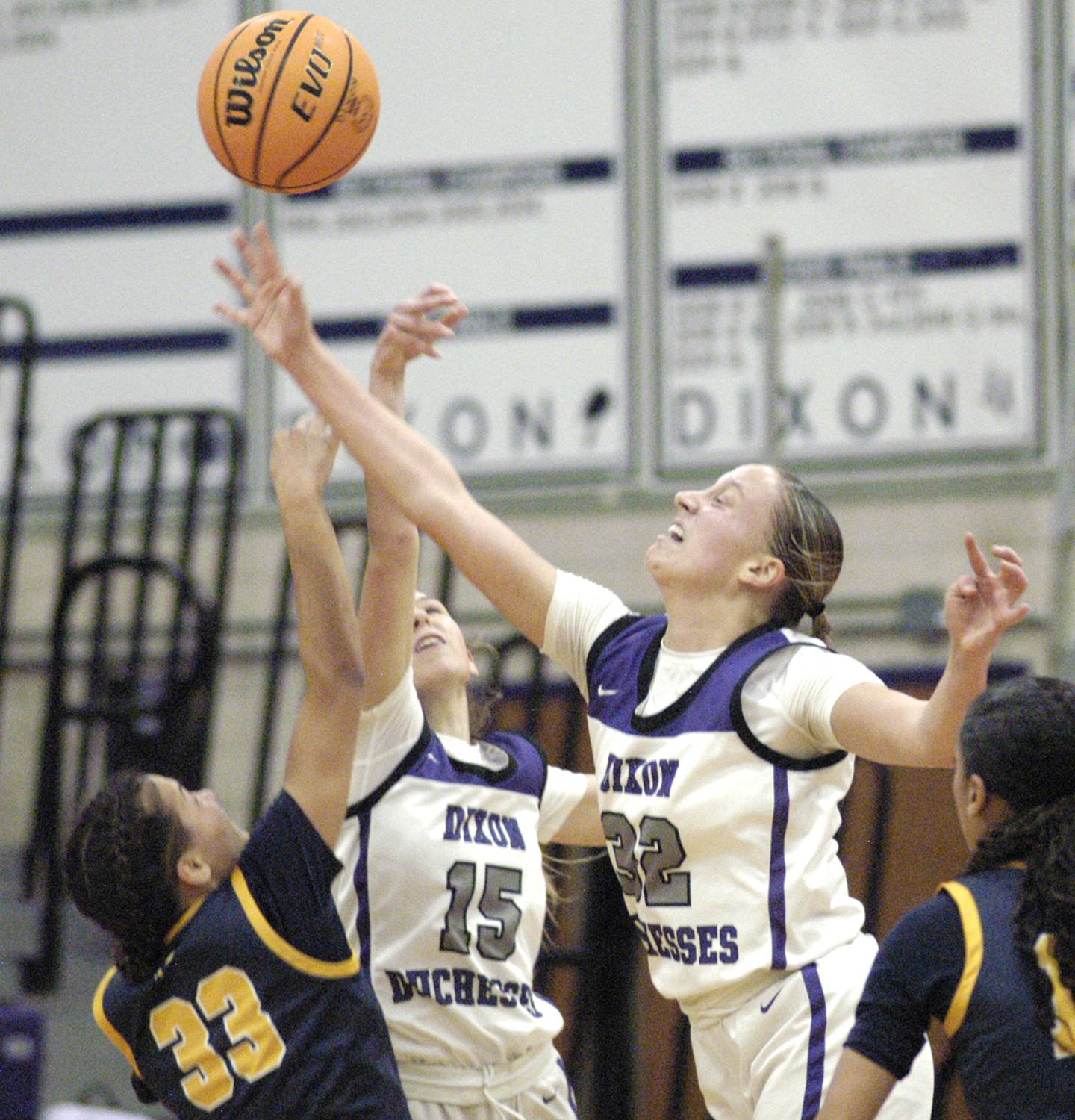 Dixon's Makenze Toms and  Morgan Hargrave battle for a ball with Sterling's Joslynn James . Dixon and Sterling girls basketball teams played in the 3rd place game of the Dixon Girls KSB Holiday Basketball Classic Saturday, Dec. 28, 2024.