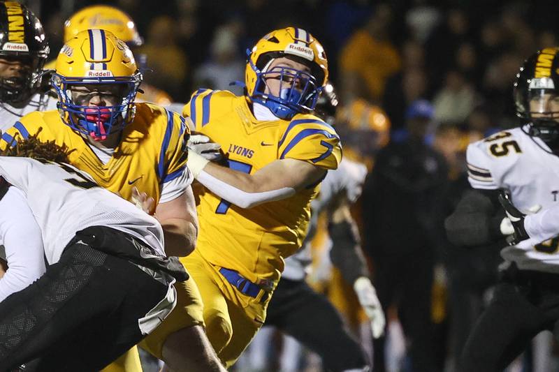 Lyons Township’s works his way through the line on a run against Joliet West in the first round of the playoffs on Friday, Nov. 1, 2024 in La Grange.