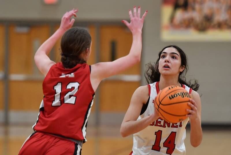 Benet’s Audrey Panoushis (14) starts to shoot during a game against Marist on January 8, 2025 at Benet Academy in Lisle.