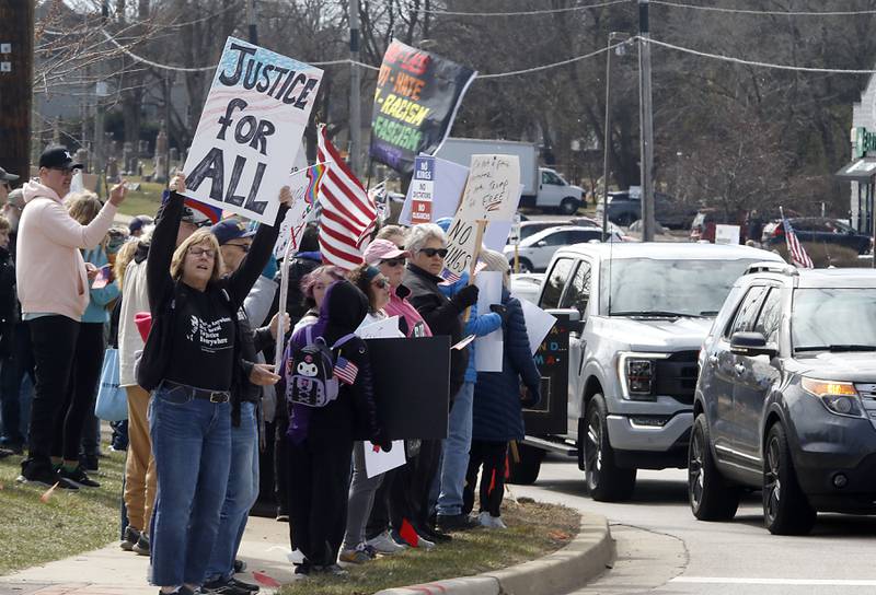 Protesters line State Route 31 near the intersection of McCullom Lake Road in McHenry to protest their discontent with President Donald Trump and his administration's policies on Saturday, March 28, 2026, during the McHenry County No Kings Protest. According to an organizer, over 4,000, people took part in the protest.