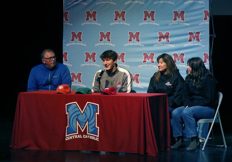 Christian Bentancur, flanked by his father, Patrick, mother, Elizabeth, and sister Angelica, announces Friday, Jan. 13, 2023, that he will attend Clemson University to play Division I football, at Marian Central High School. Bentancur, a highly recruited tight-end, narrowed his section down to Clemson from his final three colleges. The other two colleges were Ohio State and Oregon universities.