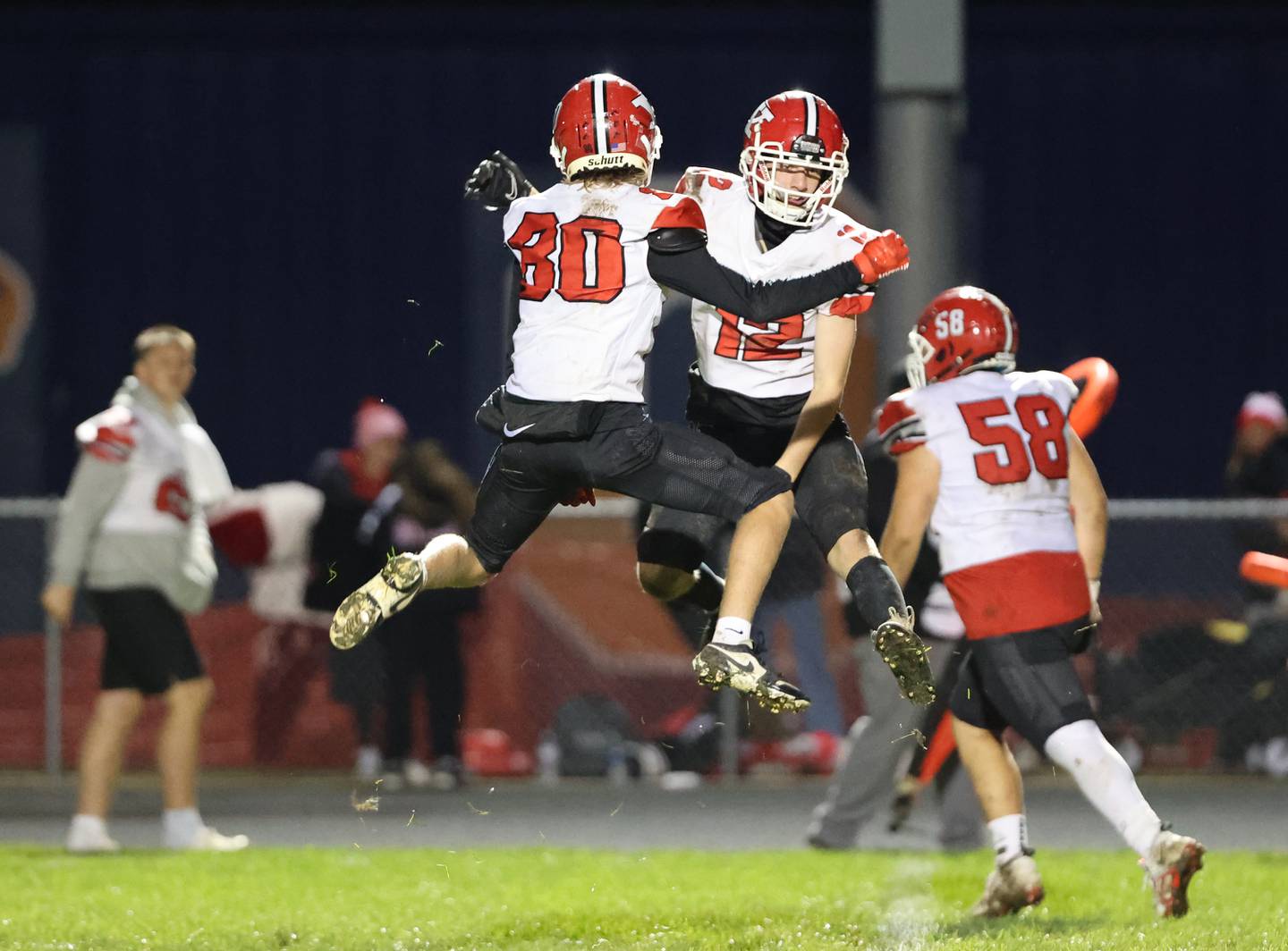 Yorkville’s Colton Spychalski (80) and Ryder Zeluff (20) celebrate a touchdown during the boys varsity football game against Oswego on Friday, Oct. 6, 2023 in Oswego.