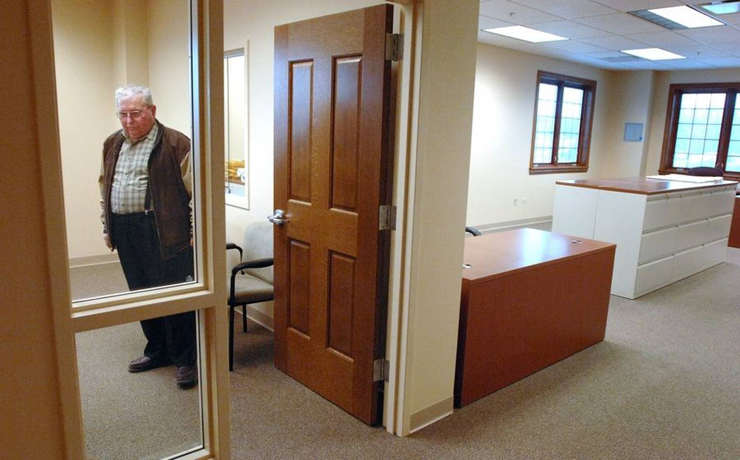 Then-Mayor Burnell Russell stands inside the clerk's office near the main reception area of the new Volo village hall at Route 60 and Fish Lake Road in 2008. Daily Herald file photo from 2008.