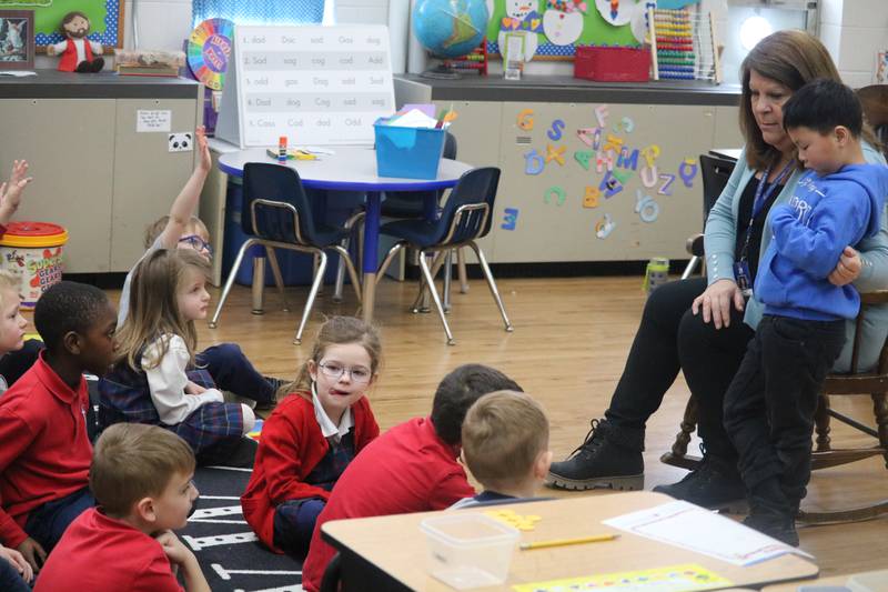 Students are seen Jan. 26, 2023 interacting with their teacher at St. Mary School.