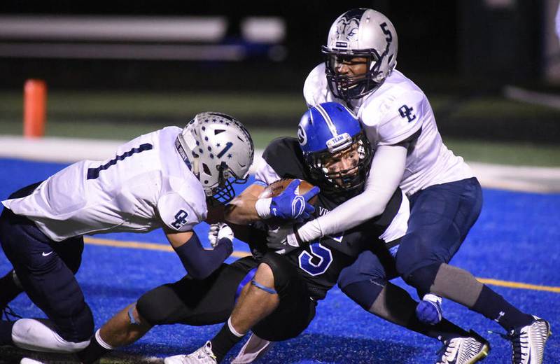 Geneva’s Justin Taormina scores a second-quarter touchdown during the Vikings’ 36-19 Class 7A first-round playoff victory Friday over Oswego East in Geneva. The Vikings advance to face Bradley-Bourbonnais in the second round.
