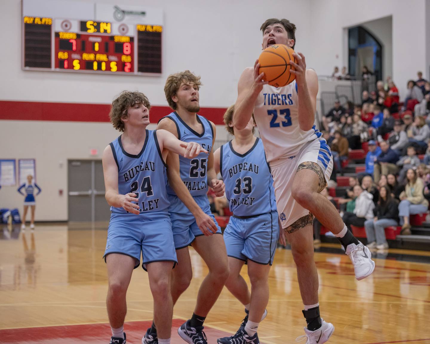 Noah Laporte of Princeton attempts a layup through numerous Bureau Valley defenders during the Colmone Classic on December 7, 2024 at Hall High School.