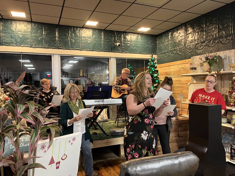 Christmas carolers sang Jingle Bell Rock at Kim's Gateway Antiques during Polo's annual Christmas festival on Saturday, Dec. 7, 2024.