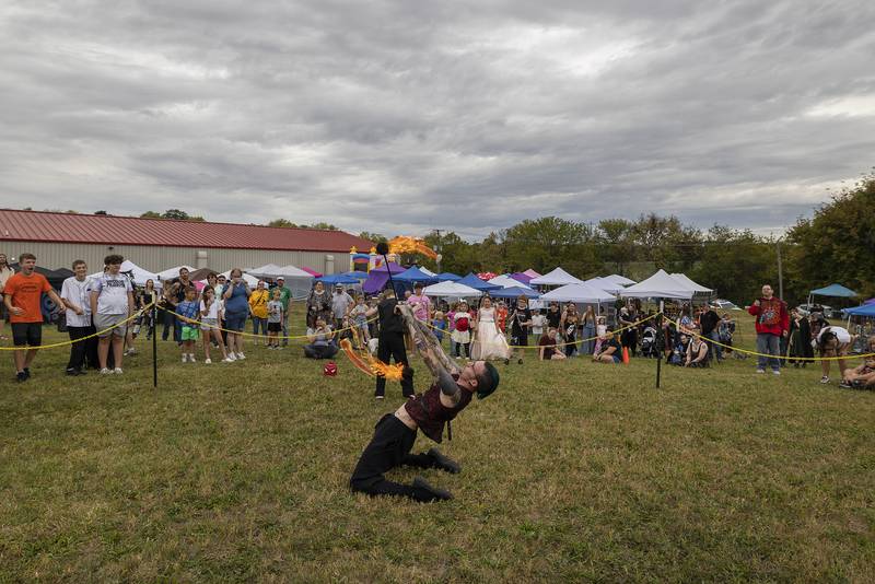 Like father, like son. Aiden, 9, and dad Michael Baker shows off their fire spinning skills Saturday, Sept. 20, 2025, at Fall Fantasy Fest in Dixon. Still a budding protege’, Aiden will be spinning real fire soon under the guidance of dad.