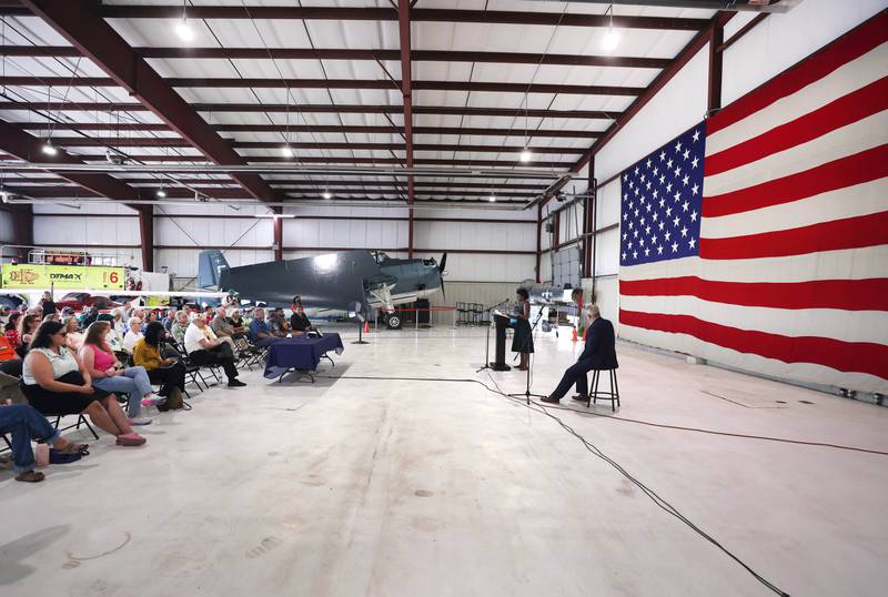 U.S. Rep. Lauren Underwood, D-Naperville, speaks to a crowd gathered for a town hall meeting Tuesday, Aug. 23, 2022, in one of the hangers at the DeKalb Taylor Municipal Airport.