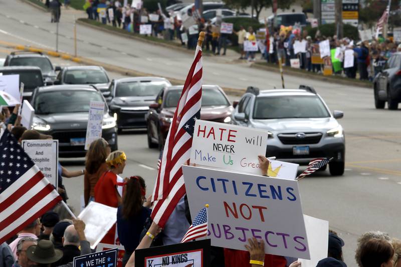 Protesters line Route 31 during a "No Kings” protest rally on Saturday, Oct. 18, 2025, in McHenry. The protest drew thousands of protesters to the area to protest the policies of President Donald Trump.