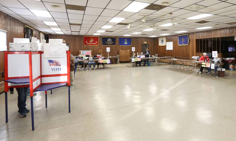 Voters and election judges run the poll at the VFW on Tuesday, Nov. 8, 2022 in La Salle.