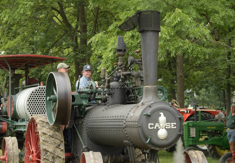 Neal Stange, left and President of the Northern Illinois Steam Power Club, Charlie Hubbard drive a 40 HP 1916 Case Tractor during Annual Sycamore Steam Show in Sycamore on Friday, Aug. 12, 2022.