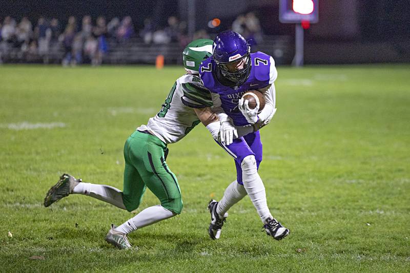 Dixon’s Cort Jacobson fights for yards against North Boone Friday, Oct. 20, 2023 in Dixon.